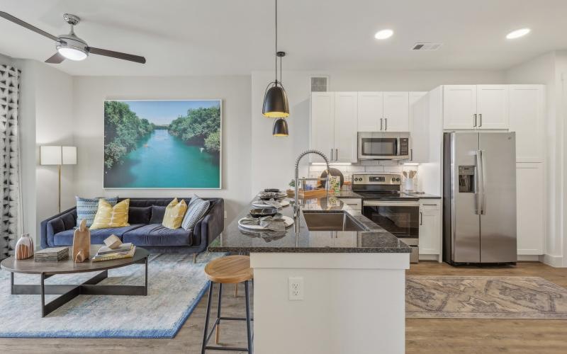a kitchen with a couch and a table