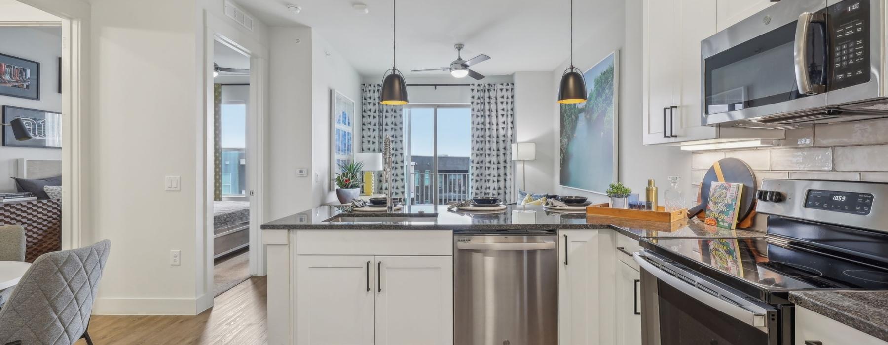 a kitchen with white cabinets