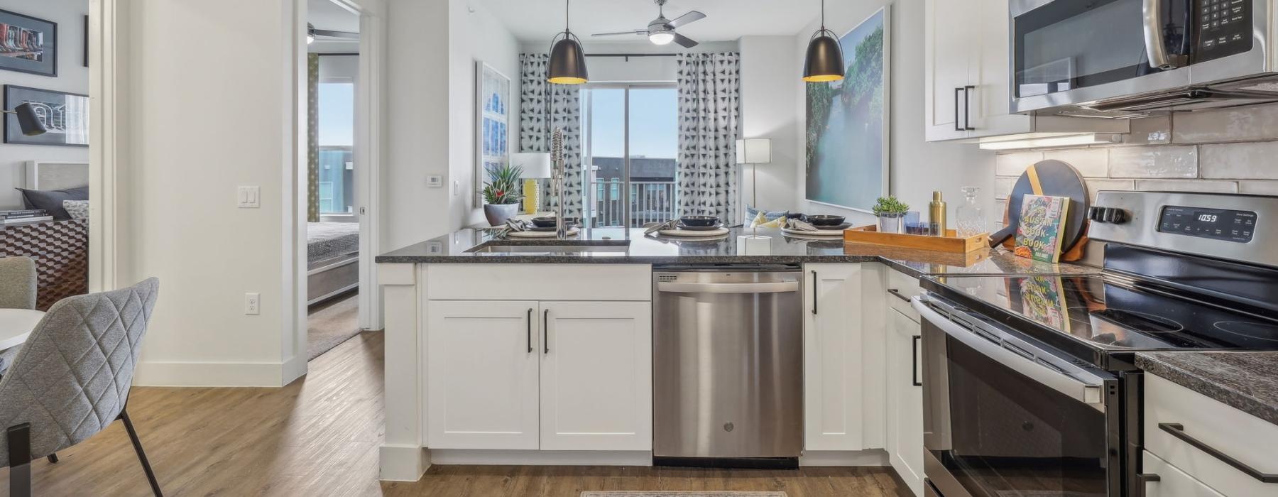 a kitchen with white cabinets